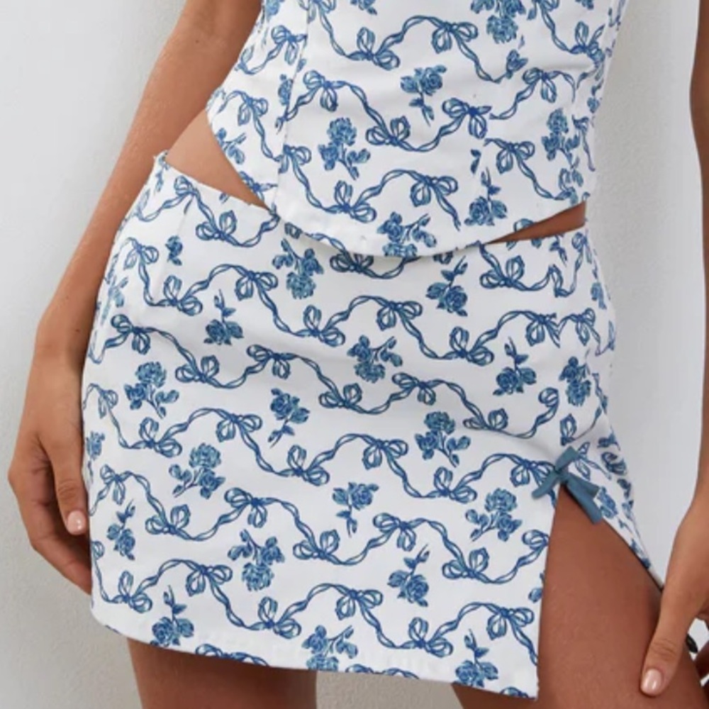 MOTEL Yatri Mini Skirt in Blue Bow Print